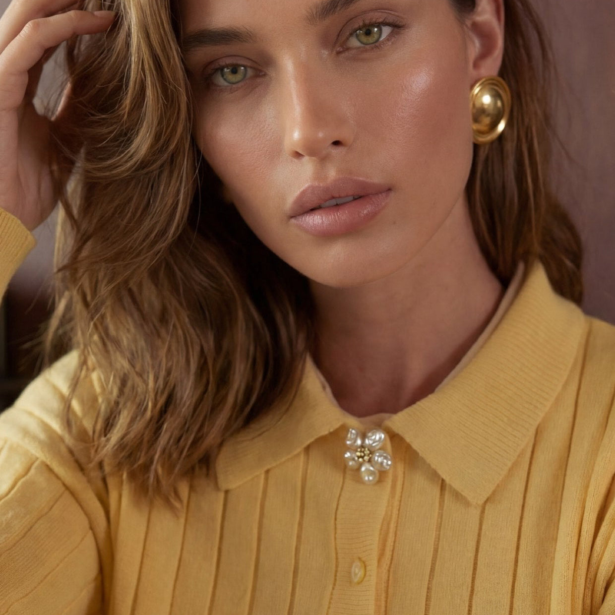 Refined by JV Baroque Blossom button cover worn as a decorative brooch on a yellow ribbed collared shirt