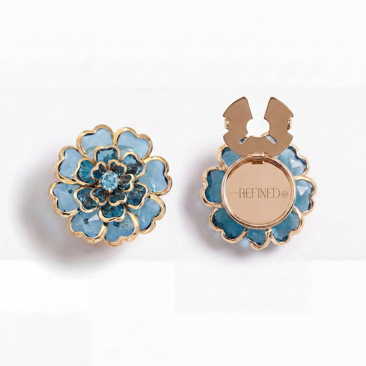 Refined by JV Camélia button covers in blue crystal with gold-tone finish, shown from front and back views.