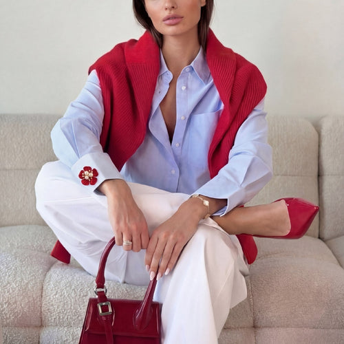 Refined by JV crimson flower button cover with pearl center worn on a light blue shirt cuff