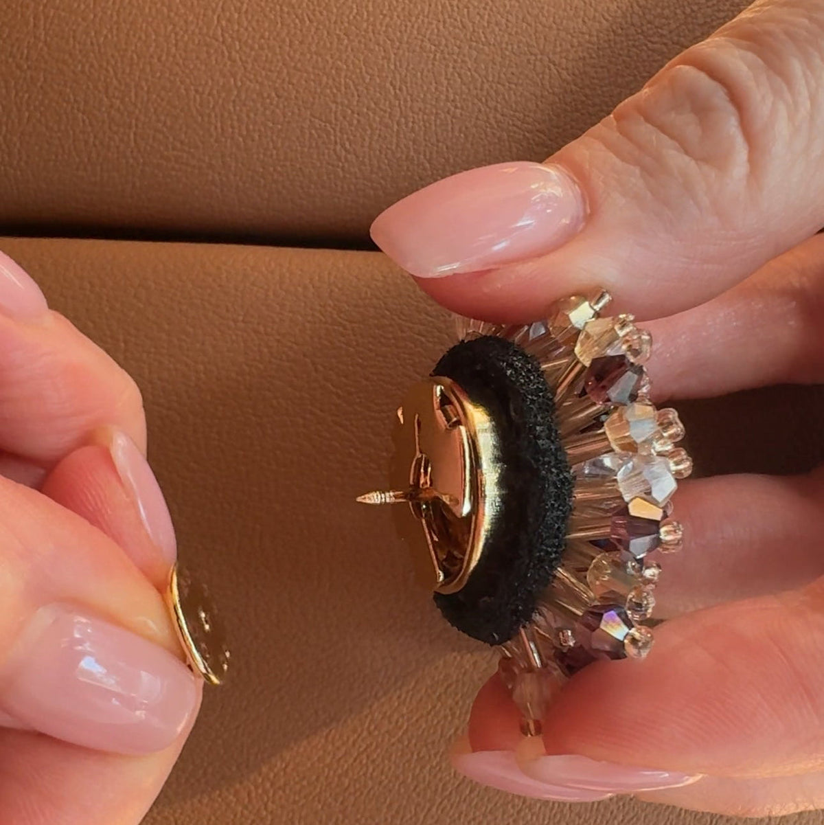 Refined by JV gold-tone custom pin being attached to a decorative crystal button cover for versatile styling.