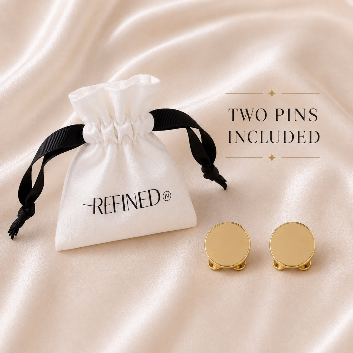 Refined by JV gold-tone button cover pins with a branded white drawstring pouch on a soft satin background.