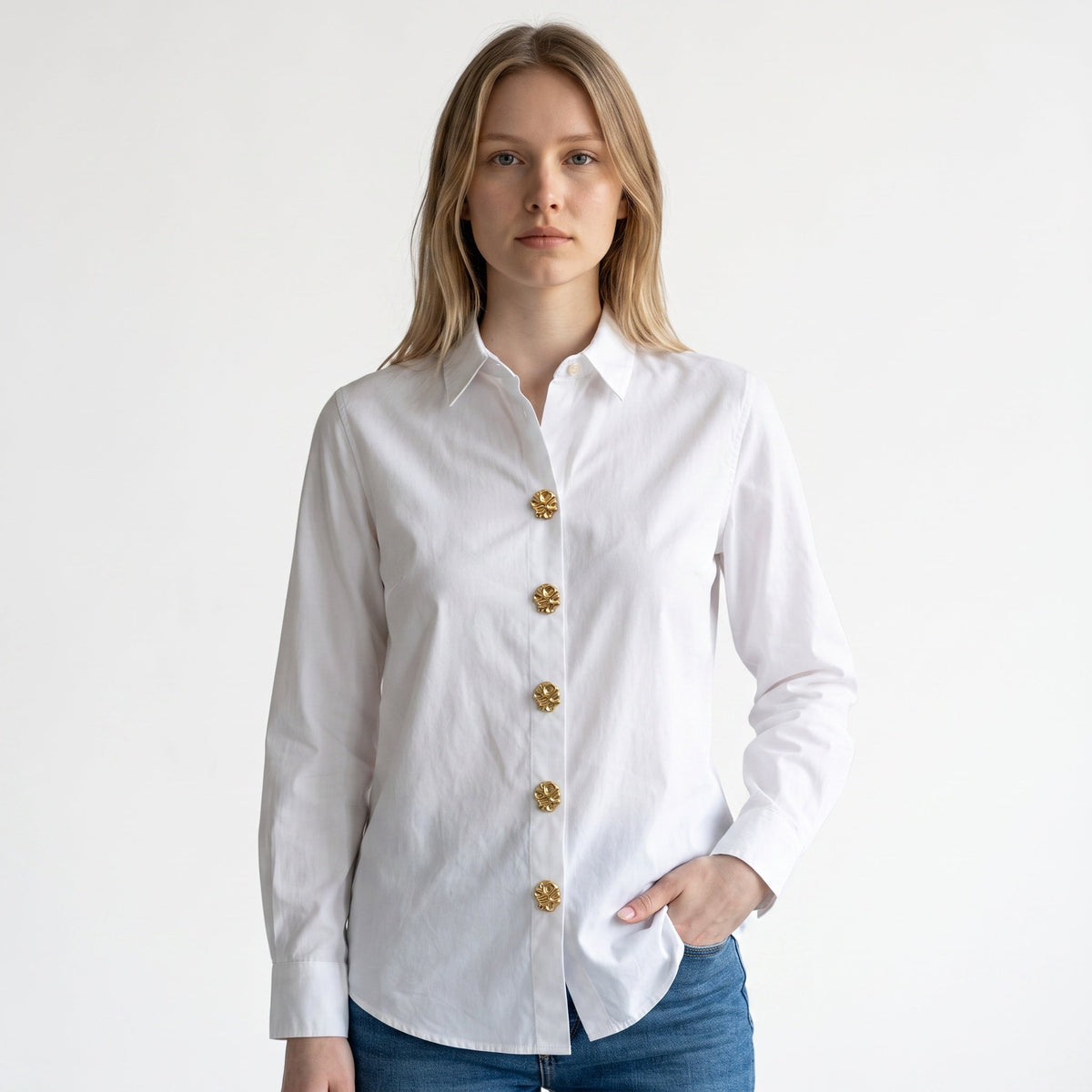Refined by JV Sculpted Gold button covers on a white button-down shirt, featuring an organic, modern metal design.