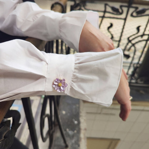 Refined by JV blush lavender camelia flower button cover attached to a white shirt cuff with gold-tone center detail