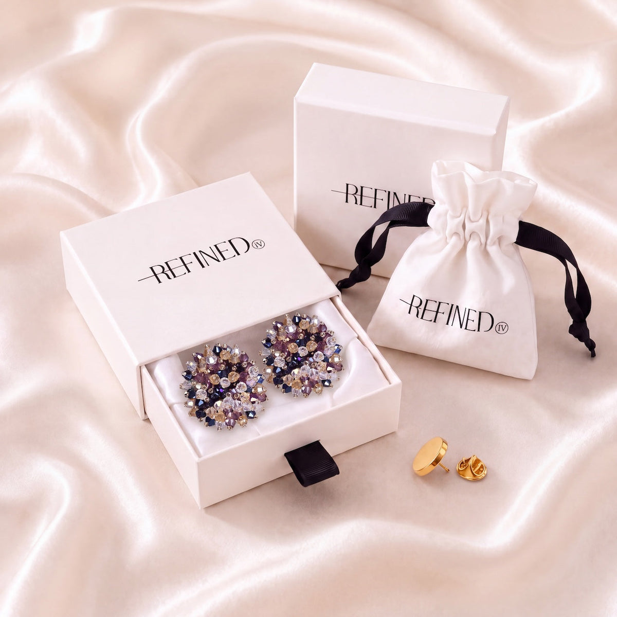 Refined by JV Nocturne button covers set with gold-tone metal, purple and clear crystals, gift box, and travel pouch.